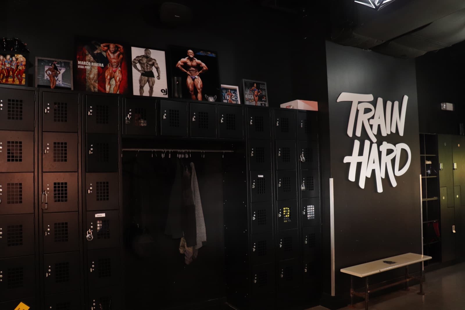 Rental lockers beneath the Train Hard sign at ProBody Fitness